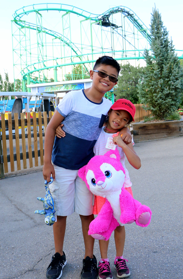 Siblings in front of rollercoaster