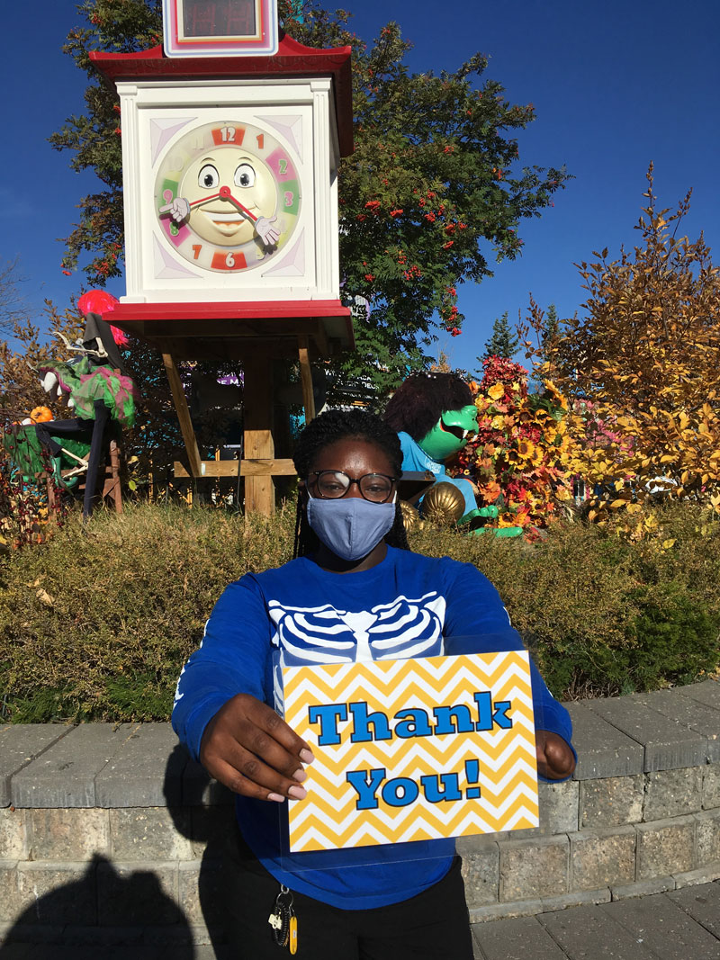 Calaway Park employee holding up a thank you sign